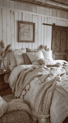 an old fashioned bedroom is decorated in white and neutrals, with wood paneling on the walls