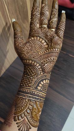 the hand is decorated with intricate designs