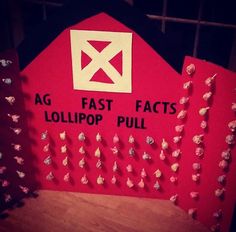 a red sign that says ag fast facts lollipop pull on the side of a barn