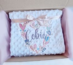 a box that has some kind of cake in it with the name coleie on it