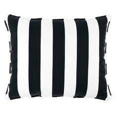 a black and white striped pillow on a white background