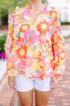 This long-sleeve blouse is stunning with its bright, colorful floral print! The ruffled detailing is so feminine and we know you are going to love that classic fit. Whether it's brunch with the girls or a day at the office, this blouse brings a touch of fun to any occasion. This blouse features long bubble sleeves, a v-neck with tied details, ruffles, and a colorful floral print. 
Material has no amount of stretch.Baileigh is wearing the small. Yellow Floral Blouse, Day At The Office, Mint Julep Boutique, Model Fits, Yellow Floral, Floral Blouse, The Office, Dress Length, Ruffles