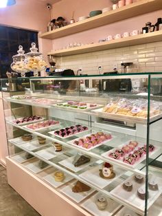 a display case filled with lots of different types of pastries