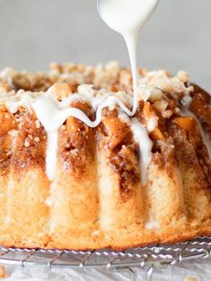 a bundt cake is being drizzled with icing