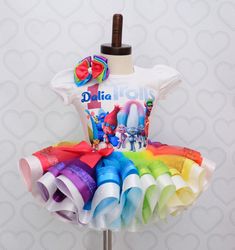 a dress made out of plastic cups with the name julia on it and rainbow colors