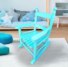 a blue rocking chair sitting on top of a white rug