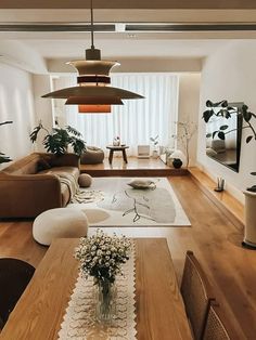 a living room filled with furniture and a wooden table