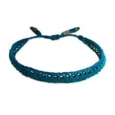 SUMMER WOVEN BRACELET: This hand-knotted, unisex, woven bracelet includes two genuine Hematite stones and a Rumi Sumaq logo bead. In a beautiful color shade of deep turquoise blue, the bracelet makes a wonderful beach accessory for summer. Purchase two as adult friendship bracelets or as a unique "his and her" couples bracelet set. Custom made in all wrist sizes, this bracelet could also be a great parent-child bracelet set.SUPERIOR CRAFTSMANSHIP:Please don't confuse this woven bracelet with you Handmade Turquoise Casual Friendship Bracelets, Casual Macrame Bracelets For Beach, Adjustable Hand Knotted Jewelry For Festivals, Casual Hand-strung Braided Bracelets For Festivals, Casual Turquoise Friendship Bracelets For Festivals, Handmade Turquoise Friendship Bracelets For Everyday, Handmade Turquoise Braided Bracelets In Spiritual Style, Handmade Turquoise Spiritual Braided Bracelets, Turquoise Braided Bracelet With Sliding Knot For Beach