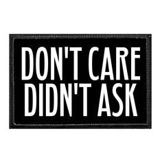 a black and white patch with the words don't care didn't ask