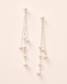 Elegance meets drama in our Kendall Pearl Earrings. These duster earrings are designed with off white pearls dangling from delicate chains of varying lengths. Lightweight for easy day to night wear. Off white, glass pearls Measures 3" in length Hypoallergenic, lead-free & nickel-free Style #4458 Dangle Pearl Earrings With Adjustable Chain, Pearl Charm Dangle Chandelier Earrings, Pearl White Linear Dangle Earrings With Pearl Charm, Pearl White Dangle Earrings With Pearl Chain, Pearl Dangle Chandelier Earrings With Pearl Charm, White Dangle Pearl Chain Earrings, Pearl Chandelier Drop Earrings With Pearl Chain, Pearl Drop Dangle Linear Earrings, Elegant Pearl Charm Chandelier Dangle Earrings