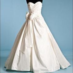 a white wedding dress on a mannequin with a black top and bottom part