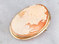 "This cameo is stunning! Crafted of gold, the simple bezel with rope frame provides a lovely framework for this classic cameo. The image here is immaculately carved. Cameo is the art of carving a layered material, creating a portrait or landscape with the difference in the colors. While traditionally done in shell, banded onyx has been used in cameo work - particularly in Greece and Italy - for hundreds, if not thousands, of years. This pendant does not come with the chain shown. Please feel fre Greece And Italy, Crystal Glassware Antiques, Rope Frame, Vintage Postage Stamps, Cameo Jewelry, Crystal Glassware, Gold Brooch, Vintage Postage, Cameo Ring