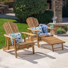 three wooden lawn chairs sitting next to each other on a cement patio with palm trees in the background