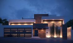 a large modern house lit up at night