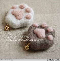 there are two small items made to look like animals paws