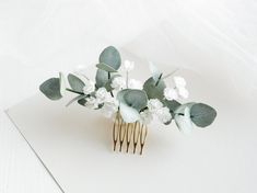 Bridal hair comb with artifical eucalyptus and babys breath flowers is perfect hair piece for your special day!  These eucalyptus and flowers look and feel so incredibly realistic. Each flowers and details is handcrafted. Amazing details, in your hair they are indistinguishable from the real thing * Size comb on foto * You can choose the color of eucalyptus. On 1 foto colour #5 * Flowers and leaves are very soft and light weight. They retain their appearance for a long time. They are not afraid of the sun, frost, or moisture (If you will get in the rain, flowers will not change.) ♥ Take a peek at other accessories with flowers in my shop! :) https://www.etsy.com/shop/FloralAccessoriesUA ♥ Please keep in mind that real colors may slightly differ because it depends on each monitor settings. Greenery Hair Piece, Bridal Floral Hair, Floral Hair Comb, Breath Flowers, Babies Breath, Floral Hair Combs, Bride Headpiece, Floral Accessories Hair, Bridal Hair Clip