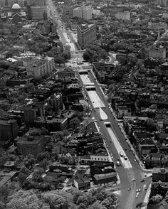 an aerial view of a city with tall buildings