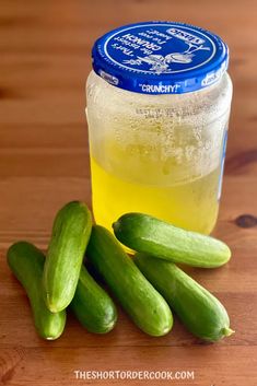 cucumbers and a jar of lemonade on a wooden table