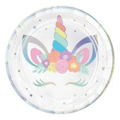 a paper plate with a unicorn face and flowers on the front, in pastel colors