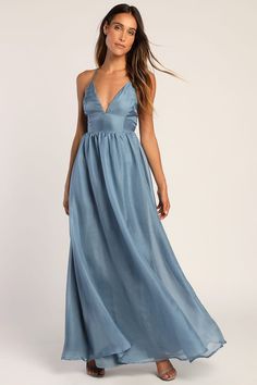 a woman in a long blue dress