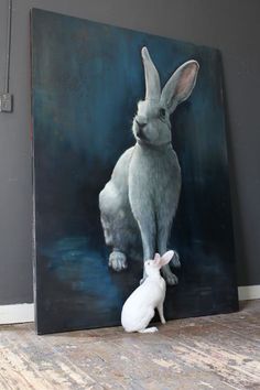 a painting of a bunny and a rabbit sitting next to each other on a wooden floor