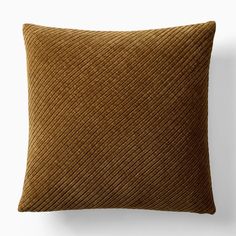 a brown pillow sitting on top of a white wall