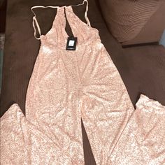 Sexy Fashion Nova Rose Gold Jumpsuit Size M-L Glamorous Pink Jumpsuits And Rompers For Party Season, Glamorous Pink Jumpsuits For Party Season, Glamorous Pink Sleeveless Jumpsuits And Rompers, Pink Backless Bodysuit For Party, Glamorous Pink Jumpsuits And Rompers For Summer, Pink Backless Party Bodysuit, Elegant Pink Bodysuit For Night Out, Glamorous Pink Summer Jumpsuit, Chic Pink Party Bodysuit