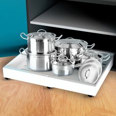 pots and pans sitting on top of a stove