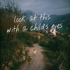 two children running down a dirt road with the words look at this with a child's eyes