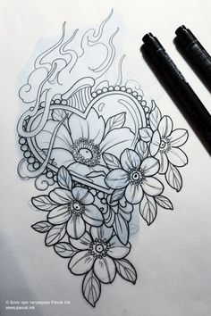 a drawing of flowers on paper next to two pens and a marker pen with some ink in it