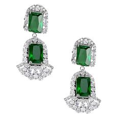 pair of emerald and diamond earrings with white diamonds on the bottom, set in 18k white gold