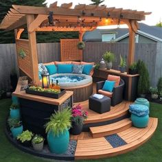 an outdoor hot tub surrounded by furniture and plants