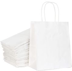 white paper bags stacked on top of each other