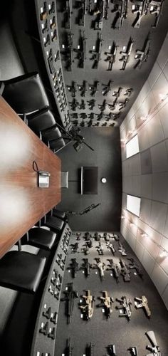 an overhead view of a conference room with many tables and chairs, all in black