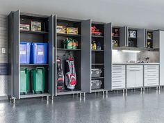 a garage with lots of cabinets and tools