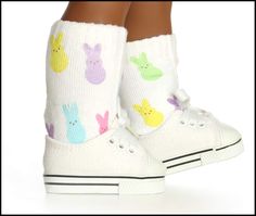 a pair of children's white shoes with colorful bunny socks