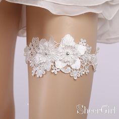 White lace wedding garters with flower applique and tiny beads. 1.Material:Lace 2.Embellishment: Lace Applique,Beads 3.Strechy:High 4.Picture Color:White 5.Quantity:1 piece/set 6.Circumference:40-60cm/15-23inch(Fits for thigh circumference of 40-60cm/15-23inch) Rhinestone Garter, Bride Garter, Bridal Garter Lace, White Garters, Wedding Garter Lace, Unique Clothes For Women, Bridal Garter, Wedding Garter, Rhinestone Bridal