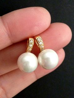 This earring features a white round pearl (10 mm) set in a 16k gold plated  tarnish resistant and nickel free cubic zirconia setting post earrings, the ear post is made of sterling silver.Size: 1.5 x 1 cmIf you need a slightly smaller pearl (8mm), just convo me, I can customize it for you, otherwise 10 mm pearl will be sent as default.Silver version is also available:Listing: http://www.etsy.com/listing/103226014/bridal-earrings-white-round-pearl-with Formal White Gold Plated Pearl Earrings, Formal Gold Pearl Earrings With Cubic Zirconia, Round Pearl White Earrings, Gold Pearl Earrings With Cubic Zirconia, Pearl White Round Earrings, Formal White Gold-plated Pearl Earrings, Gold Earrings With Pearl Charm And Cubic Zirconia, Pearl Bridal Earrings Gift, Round Shape, White Hypoallergenic Pearl Earrings Gold Plated