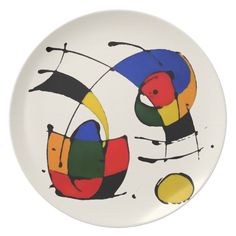 a white plate with an abstract painting on the front and sides, in different colors