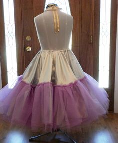 This crinoline petticoat is made to match your wedding dress colors or your wedding colors. The pictures shown are for a silver and lavender fall wedding. I can make this crinoline in most any color combination that is available in fabrics. This crinoline is best suited for 1950s 50s swing dresses that are very voluminous and very full. Makes a gorgeous accessory to your reception dancing 50s swing dresses brides . The crinoline base fabric is bridal satin. The tulle is a very stiff crinoline tu Ruffled Tiered Skirt Petticoat For Costume Party, Tiered Ruffle Petticoat For Costume Party, Ruffled Tiered Petticoat For Costume Party, Party Petticoat With Ruffled Crinoline Skirt, Fitted Princess Petticoat For Costume Party, Costume Party Full Tulle Petticoat, Vintage Full Skirt Petticoat For Costume, Full Tulle Petticoat For Costume Party, Tulle Ruffled Petticoat For Costume Party