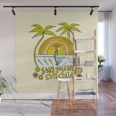 a wall mural with the words stay calm and sunchild on it in front of a beach scene