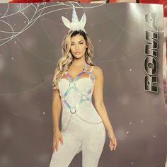 a woman in a white bunny costume posing for the camera