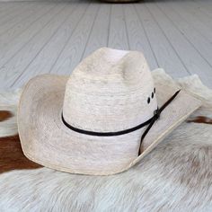 Flaunt your western flair with the Ariat hat from M&F Western Products. It features a two-cord chocolate hatband, a robust and durable design, and is handcrafted from high-quality materials. The hat boasts a crown of 4 3/8 inches and a brim measuring 4 inches. Brim: 4" Crown: 4 3/8" Color - Natural Palm Palm Leaf Straw Western Hats For Ranch, Classic Brown Straw Hat For Western-themed Events, Western Style Panama Hat For Outdoor, Western Straw Hat With Curved Brim For Rodeo, Western Brown Panama Hat, Western Style Brown Panama Hat, Western Curved Brim Straw Hat For Rodeo, Classic Brown Sun Hat For Western-themed Events, Western Style Curved Brim Straw Hat For Rodeo