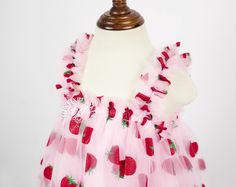 🎀 Welcome to MuslinblanketVN! We specialize in handcrafted children's dresses, offering a wide variety of styles, materials, and colors. Our attention to detail and quality craftsmanship are second to none. Every dress is made with care and can be customized to your specifications. Explore our collection and find the perfect dress for your little one! **Dress Details - Dress Color: Red, Pink,... - Material: Tulle, Cotton Celebrate your little one's first birthday or any summer occasion in our charming Strawberry Romper Collection. Crafted with the sweetest attention to detail, these stylish rompers feature a playful strawberry print and gingham pattern in a vibrant pink hue. The Strawberry Romper Bubble and Smocked Romper styles offer a classic silhouette with flirty ruffles or delicate s Strawberry 1st Birthday, Strawberry Romper, 1st Birthday Dress, Smocked Romper, First Birthday Dress, Berry First Birthday, Children's Dresses, 1st Birthday Dresses, First Birthday Dresses