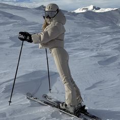 a person on skis standing in the snow