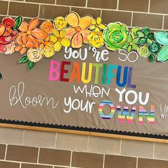 a sign on the side of a building that says you're beautiful when you own it