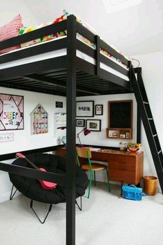 a loft bed with a desk underneath it and a black chair under the bottom bunk