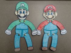 two paper cut outs of mario and luigi