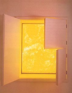 an open window with yellow light shining in it's center and on the outside