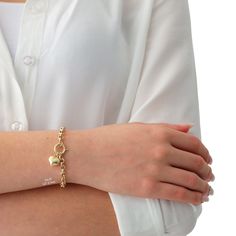 "\"14k Gold Rolo Link Bracelet with Heart Charm | Thick Belcher Chain Gold Bracelet, Sailor Lock Clasp, Puffy Heart Charm | Gift for Her\" ◖ P R O P E R T I E S ◗ * Material: 14k Gold * Weight #1: 2,8gram (for 7\", with charm, ±5%) * Weight #2: 5,9gram (for 7\", with charm, ±5%) Contact me if you are unsure about length. Photos belong to the #2 Large Rolo Bracelet except last 2 photos ◖ D I O N J E W E L ◗ ‣ 14K REAL GOLD ‣ EXPRESS DELIVERY IN 1-3 DAYS* ‣ HANDMADE ONLY FOR YOU, NO USED JEWELRY ‣ Bracelets With Spring Ring Clasp As Gift, Gift Bracelets With Spring Ring Clasp, Tarnish Resistant Charm Bracelet For Anniversary, Everyday Heart Bracelet With Lobster Clasp, Valentine's Day Gold Bracelet With Adjustable Chain, Dainty Heart Bracelet With Charms, Gold Heart Bracelet With Charms, Heart Pendant Charm Bracelet For Anniversary, Yellow Gold Heart Bracelet With Charms